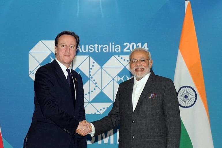 Cameron greets man held responsible for massacre of thousands of Muslims