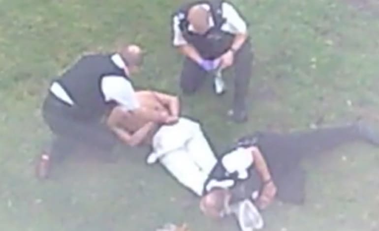 Sean Rigg restrained by officers.