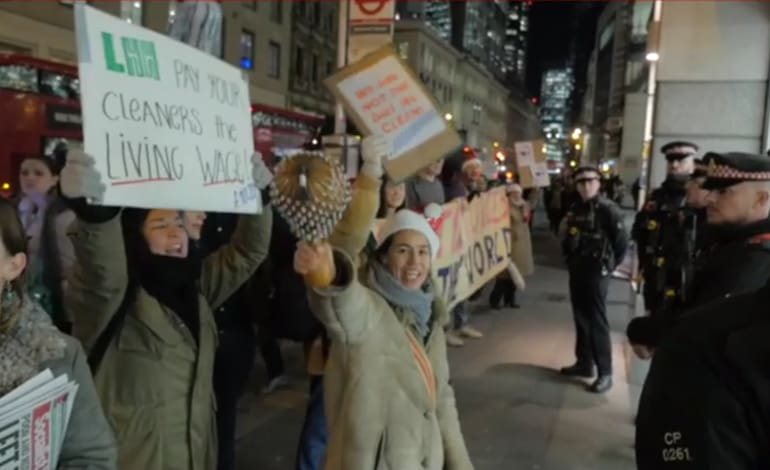 United VOices of the World protest outside Lee Hecht Harrison