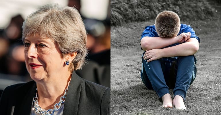 Theresa May and young boy