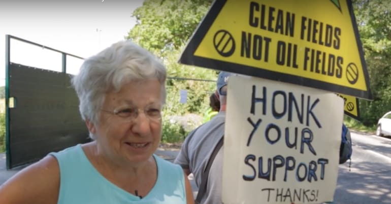 Woman protesting outside drilling site company seeking injunction