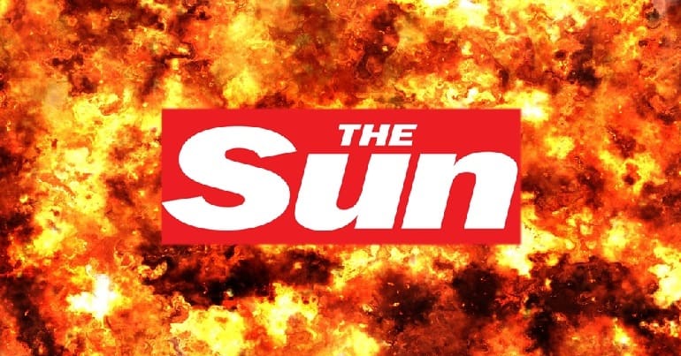 The Sun logo, flames