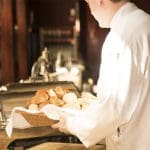 Underpaid workers minimum wage picture of hotel worker
