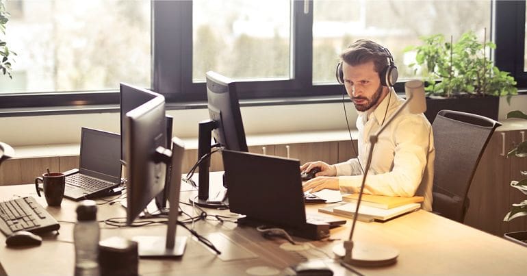Man at office desk employers workplace stress