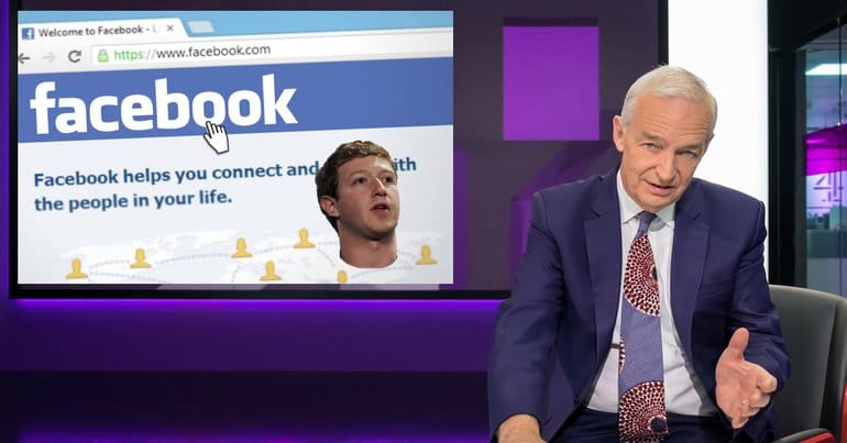Jon Snow presenting the news with an image of Facebook's Mark Zuckerberg behind him