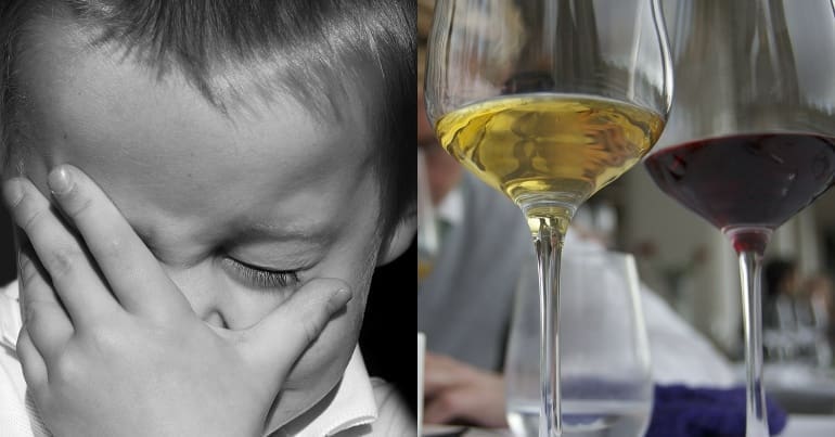Child with head in hands. Glasses of wine hungry children and luxury travel