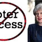 A 'no-voter-access' sign and a picture of Theresa May