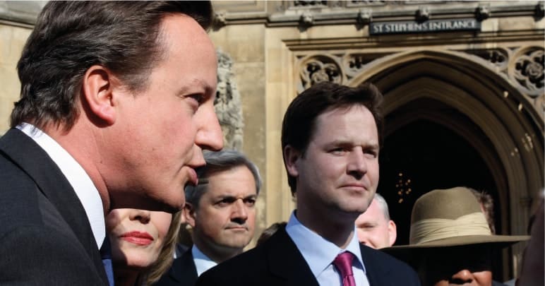 Nick Clegg standing in the shadow of David Cameron