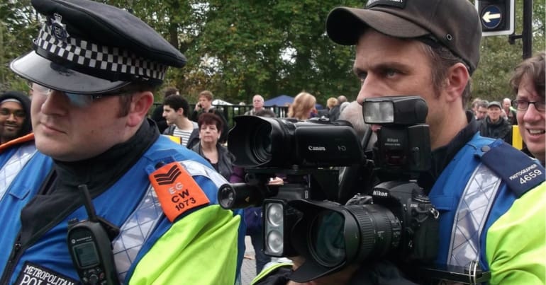 Police forward intelligence teams with a big camera