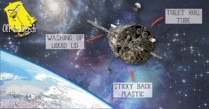 A cardboard model of a satellite floating in space