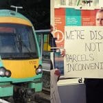 A Southern Rail train and a campaigner