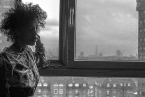 Woman looking out of window