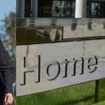 Theresa May and Home Office sign