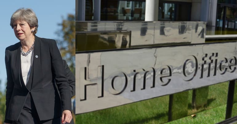 Theresa May and Home Office sign