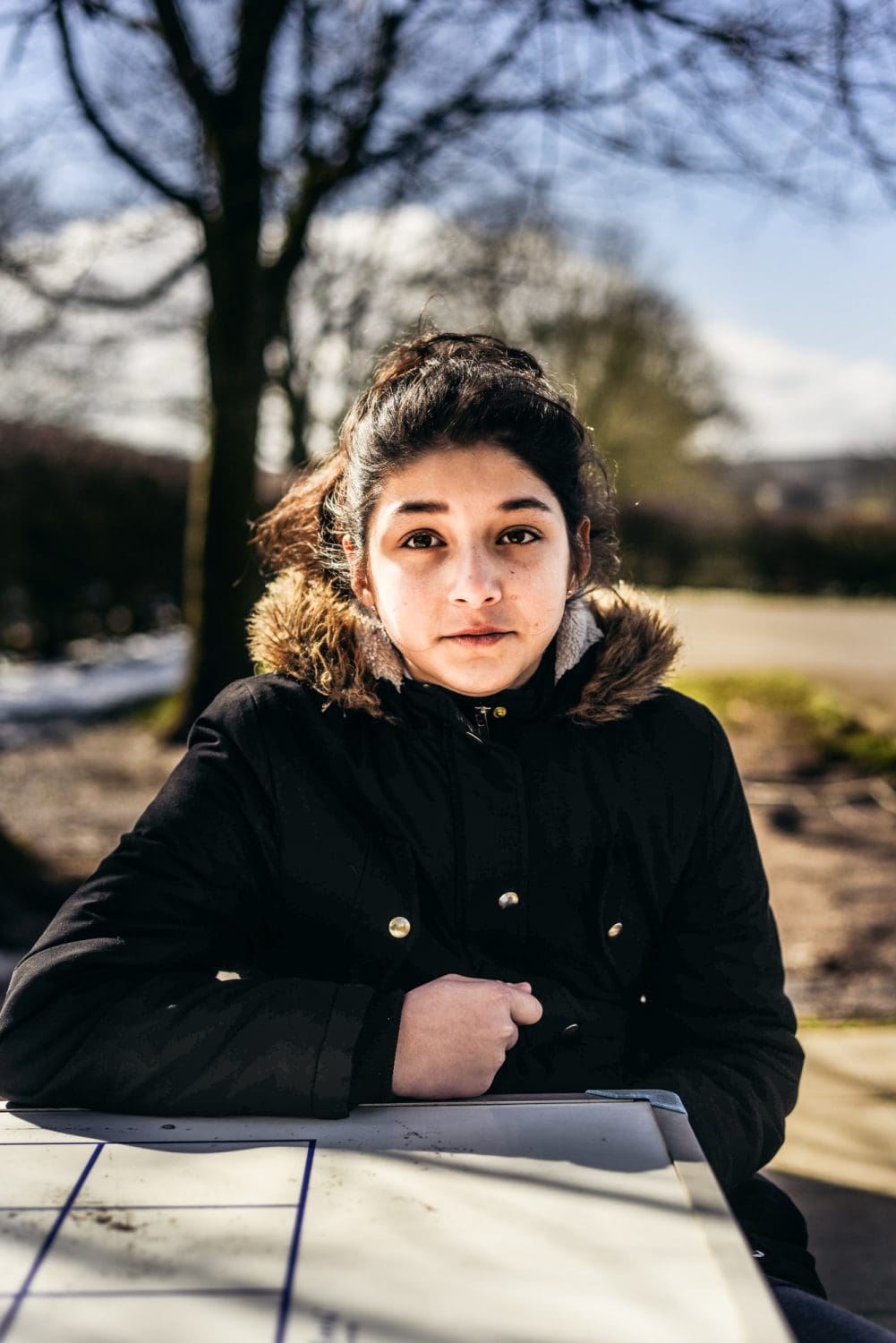Young woman sitting outside