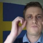 Right-wing activist Peter Sweden with his hands held up making circles
