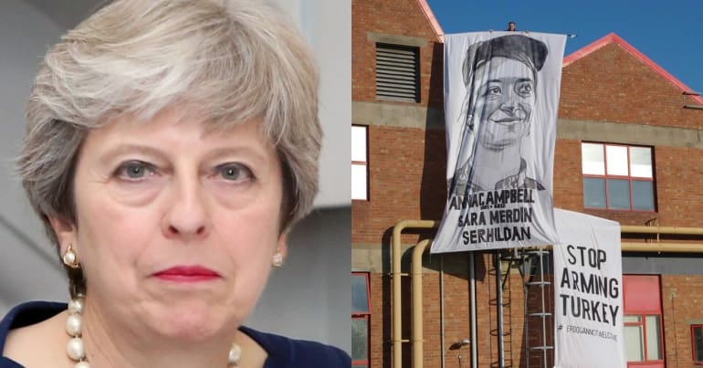 Theresa May and banner drop at Airbus