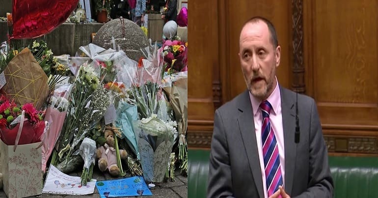 Eddie Hughes and flowers after Manchester bombing
