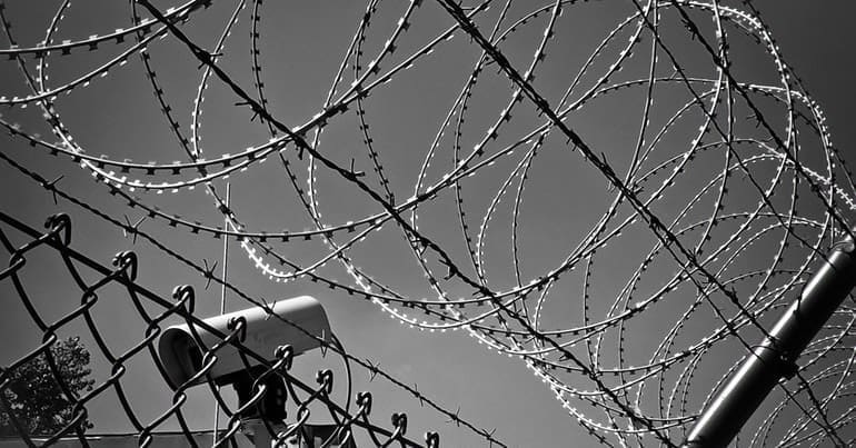 Barbed wire and a security camera