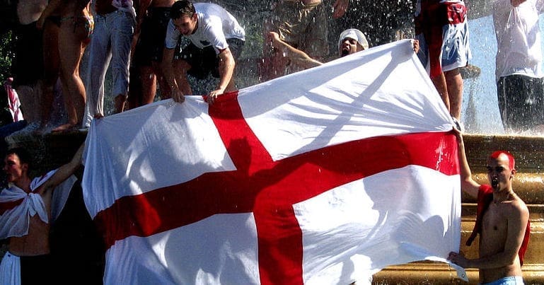 England football supporters holding up an England flag