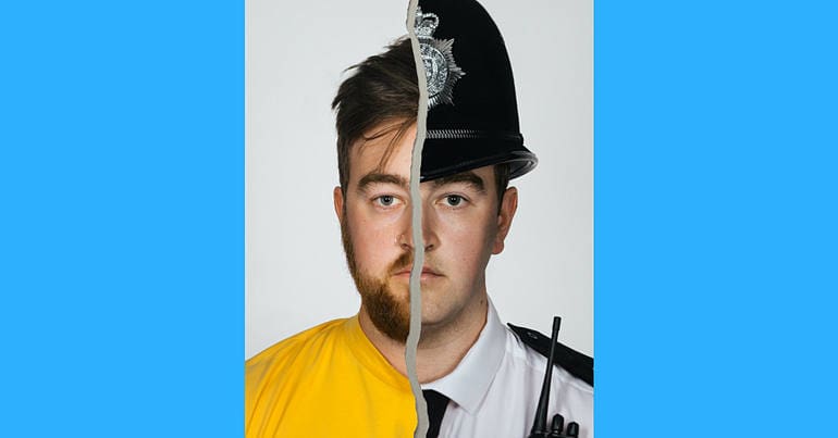 An image of a man, dressed half as an activist and half as a police officer