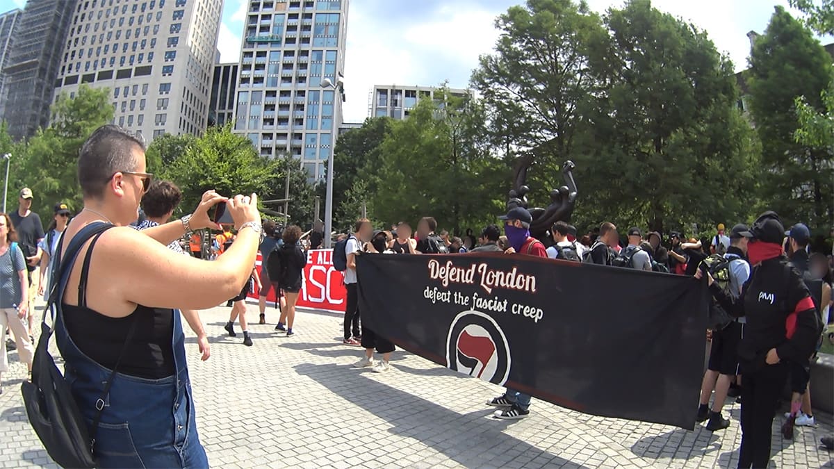 Anti-fascists holding a banner in Jubilee Gardens