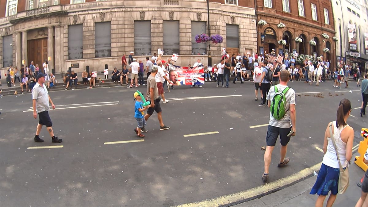 Tommy Robinson supporters holding a banner that says #FreeTommyRobinson