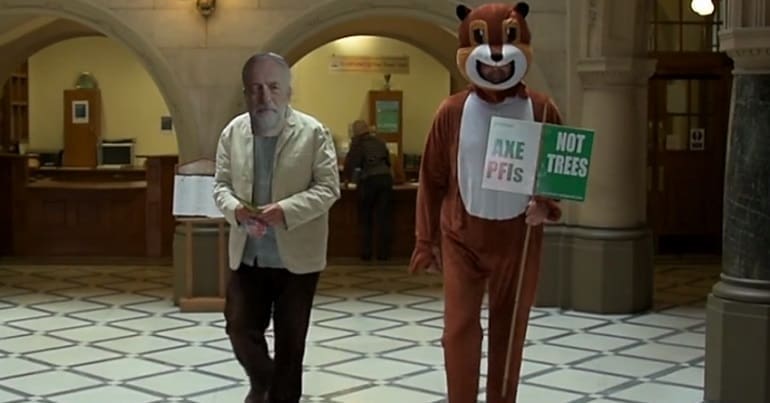 A clip from a film about the Sheffield trees saga. It shows a man with a Jeremy Corbyn mask and a person in a squirrel costume