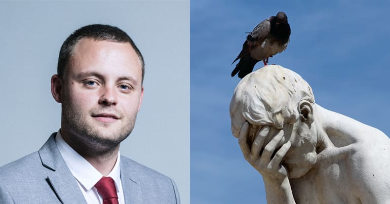 Ben Bradley and statue of a man face-palming