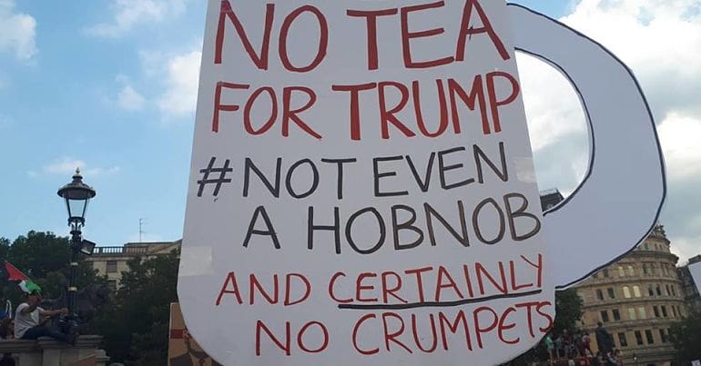Protest sign that reads: No tea for Trump - not even a hobnob, and certainly not crumpets'