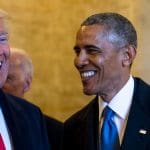 Trump and Obama smile while meeting in Washington.