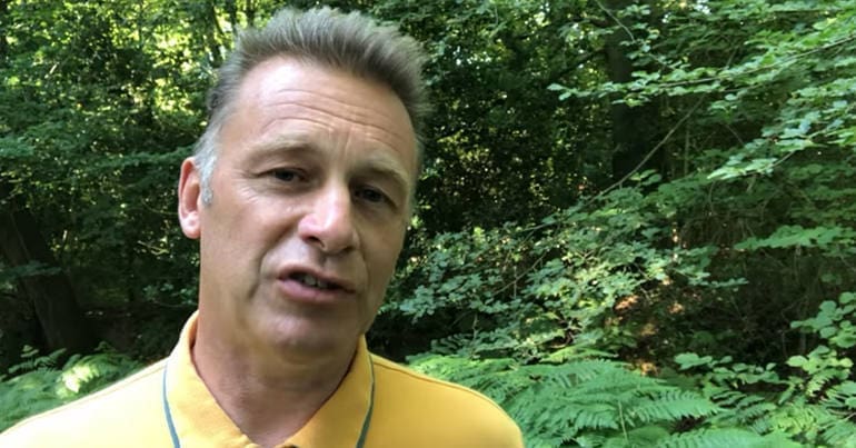Chris Packham in a wood