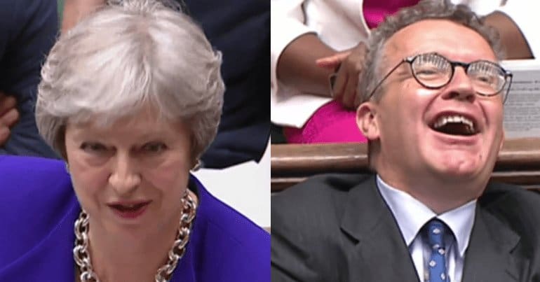 Theresa May and a laughing Tom Watson