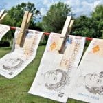 ten pound notes hanging on a washing line