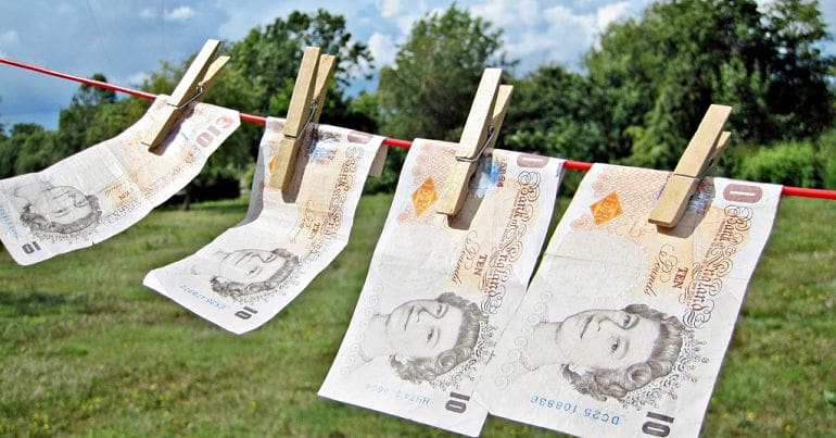 ten pound notes hanging on a washing line