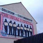 Mural with names & ideas related to British state collusion in Northern Ireland