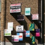 Homes to rent signs on a building
