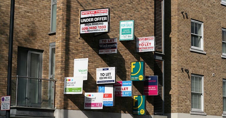 Homes to rent signs on a building