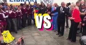 Theresa May facing some South African children with a 'VS' in between them