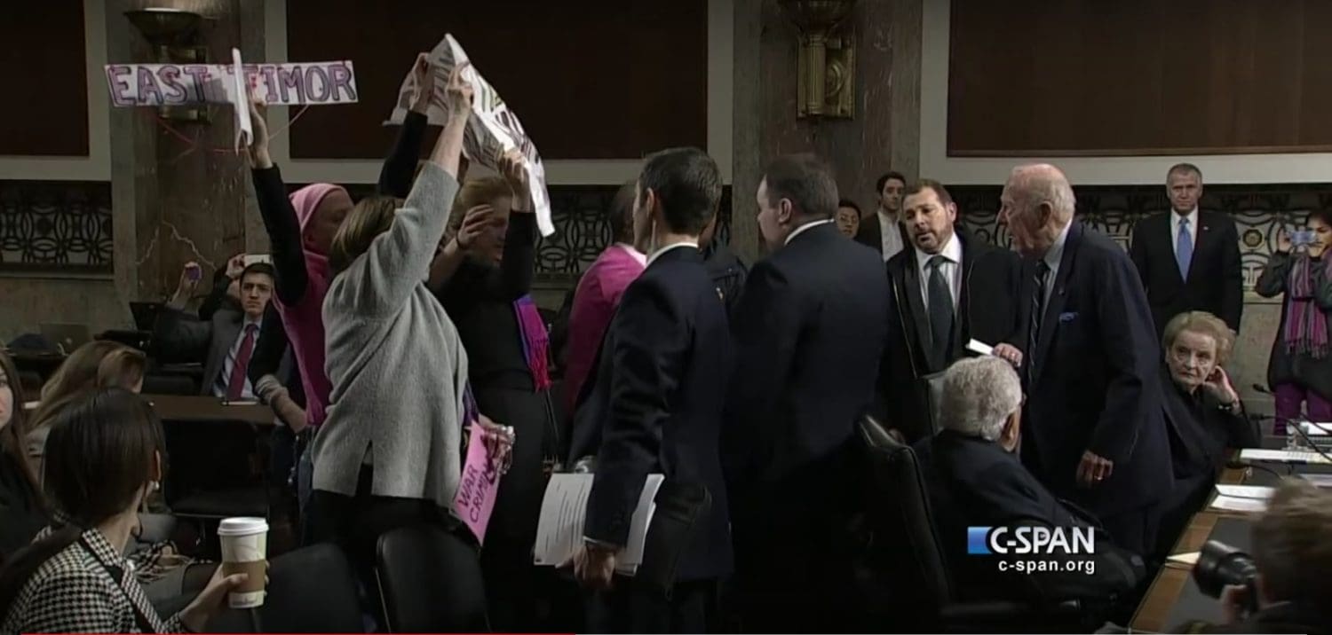 Code Pink Anti-war protestors at senate hearing with with former Secretaries of State Henry Kissinger, Madeleine Albright, and George Shultz