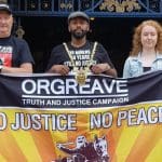 Magid Magid standing behind a 'Truth and Justice for Orgreave' banner