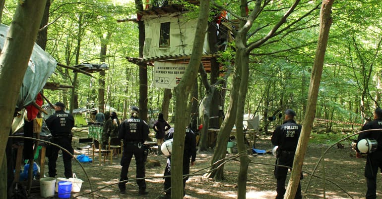 Police arresting activists protecting Hambach Forest, Germany.