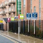 Row of houses with to let signs