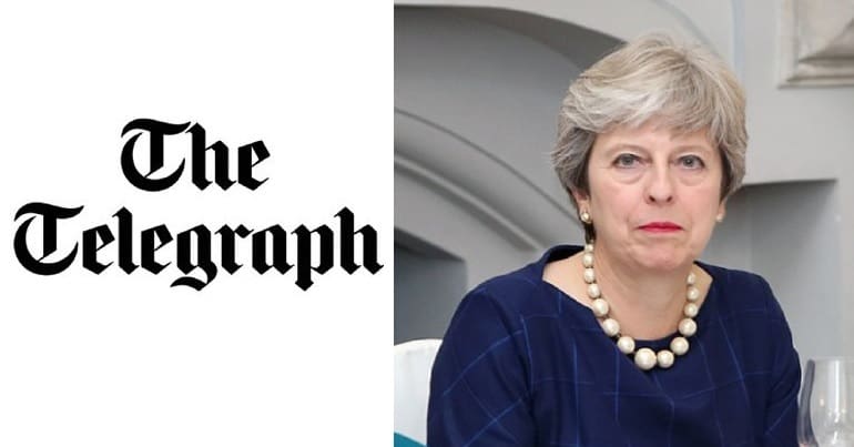 The Telegraph logo and Theresa May
