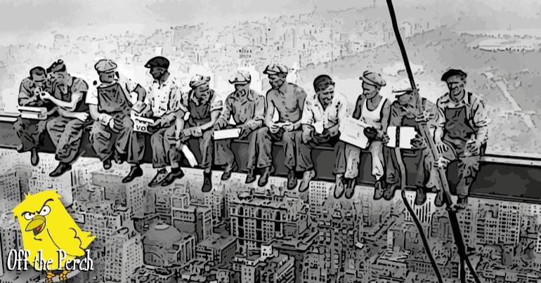 Workers sitting on a girder above the New York skyline