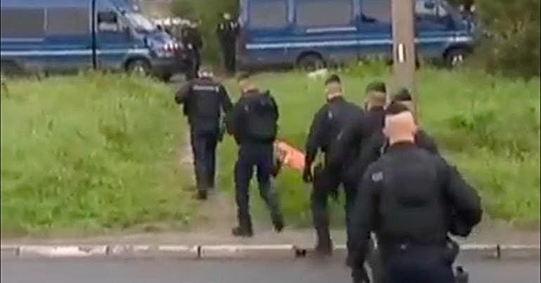 French police at refugee camp near Dunkirk