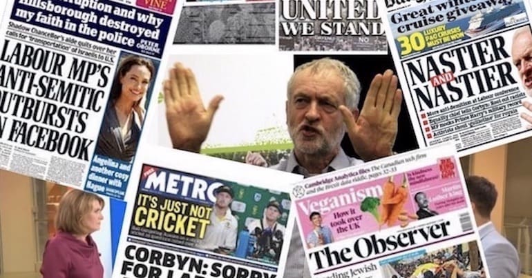 Jeremy Corbyn surrounded by a collection of newspaper front pages