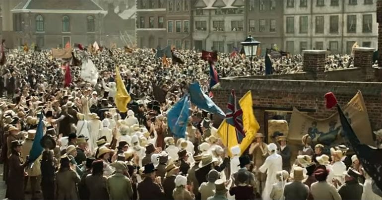 Still from the film 'Peterloo' showing flag waving crowds