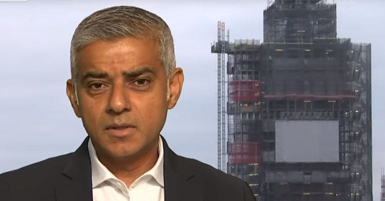 Sadiq Khan with construction work in the background