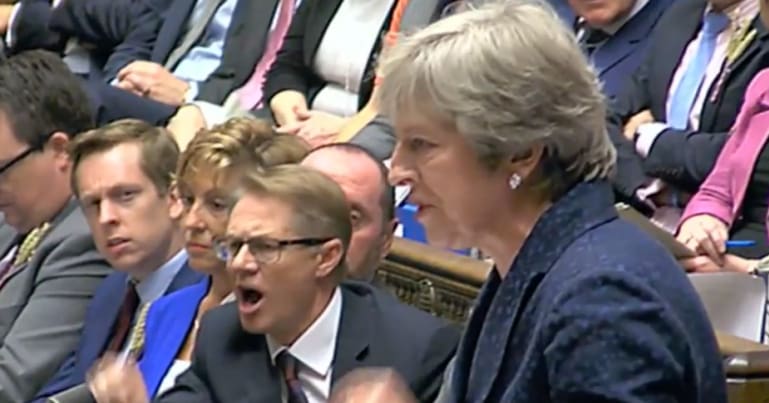 Theresa May and Tory MP shouting at PMQs